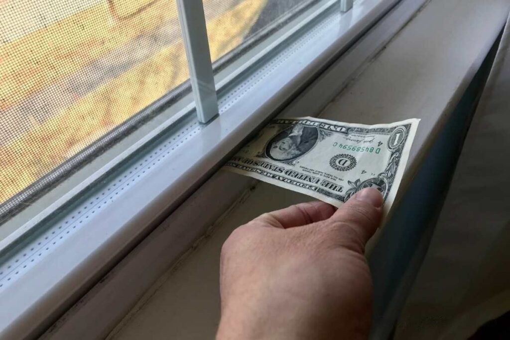 Dollar bill test checking window air leaks and insulation